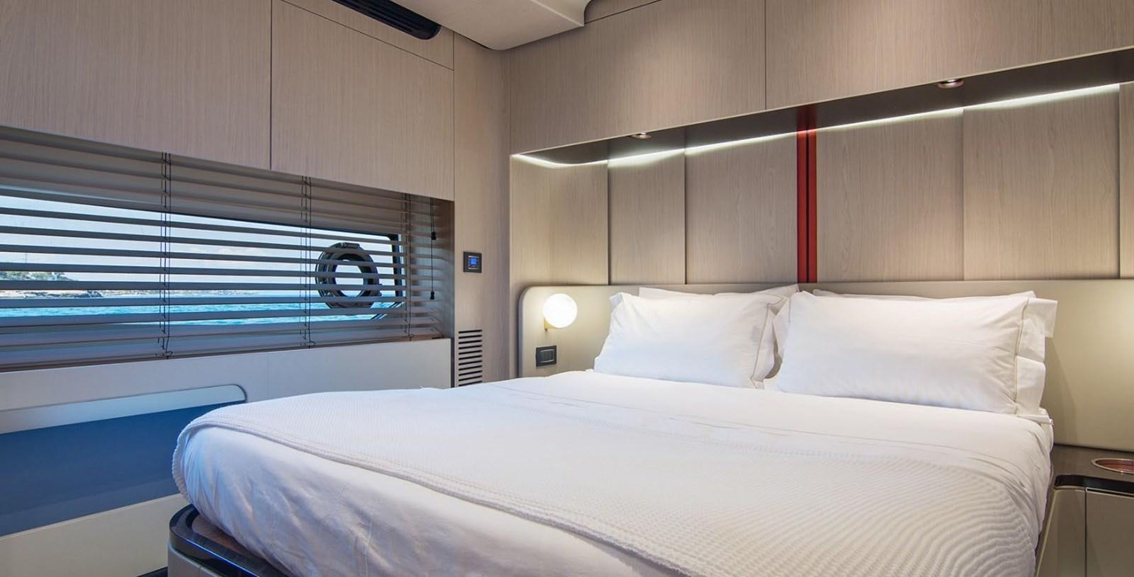 a bed with white sheets aboard ALEX I Yacht for Sale