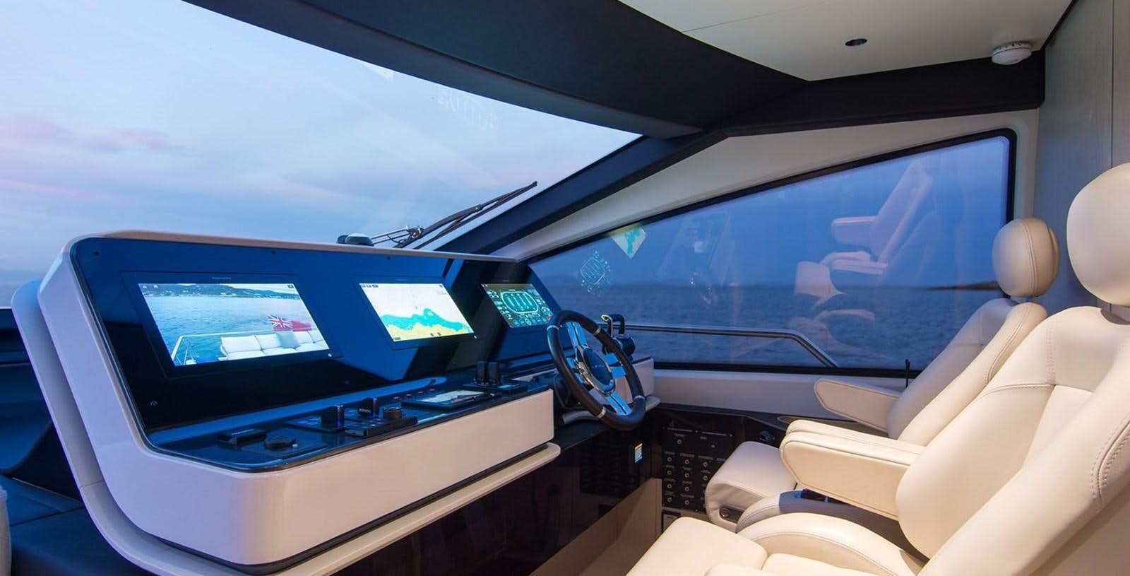 inside of a car with a computer and monitor and a window aboard ALEX I Yacht for Sale