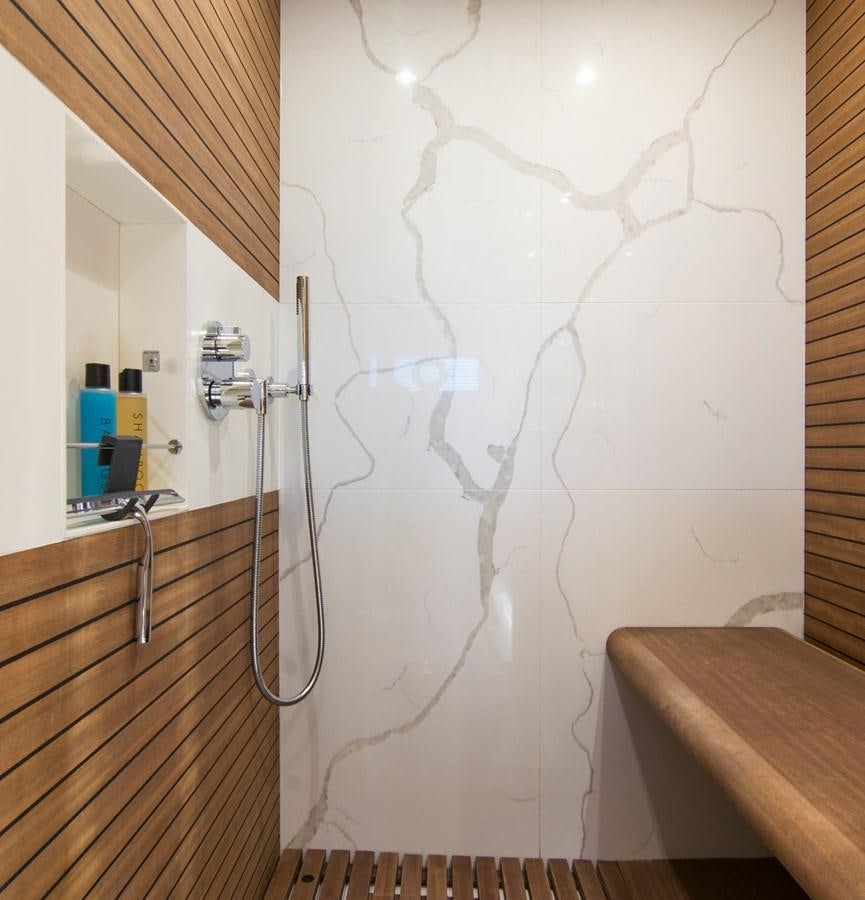 a shower with a sink and a mirror aboard ALEX I Yacht for Sale