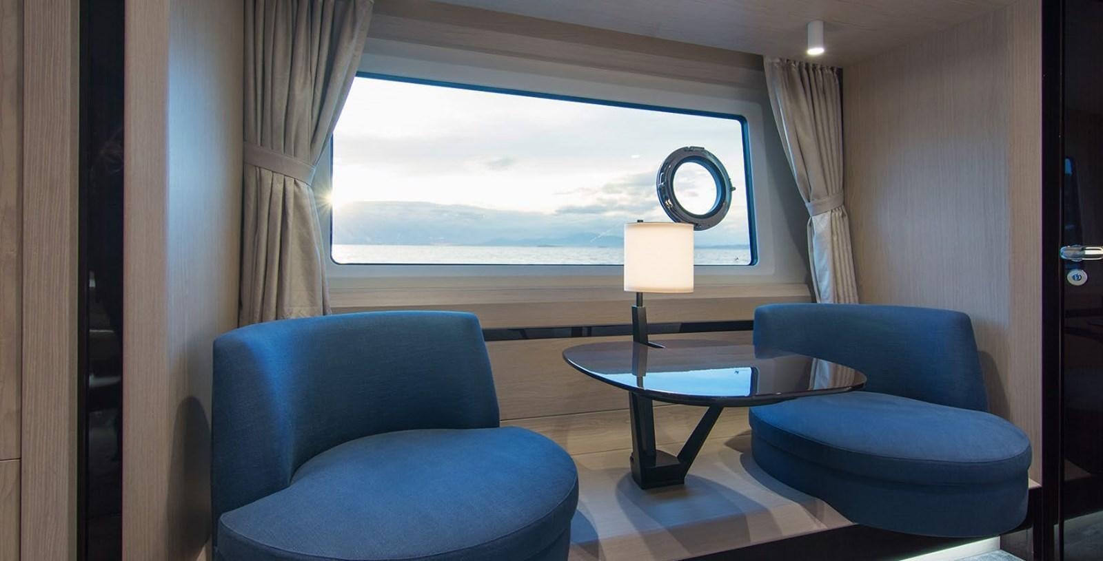 a room with a table and chairs aboard ALEX I Yacht for Sale