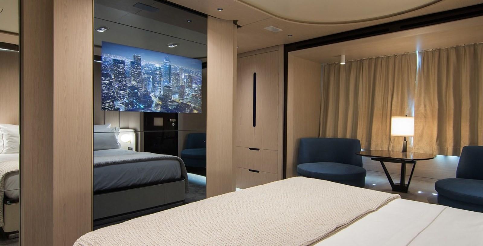 a room with a bed and a chair aboard ALEX I Yacht for Sale