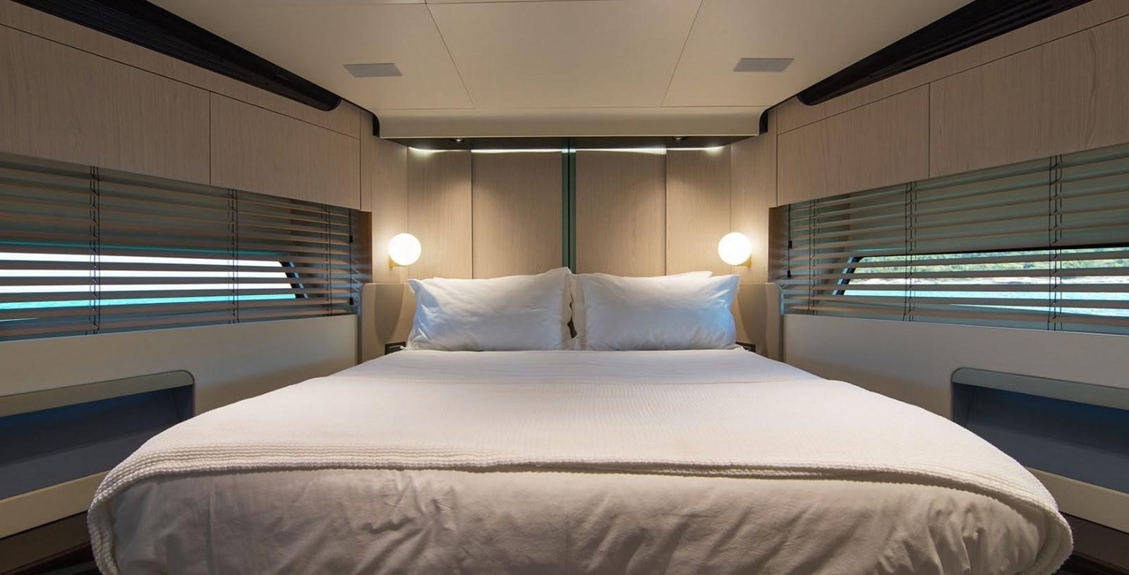 a bed with white sheets aboard ALEX I Yacht for Sale