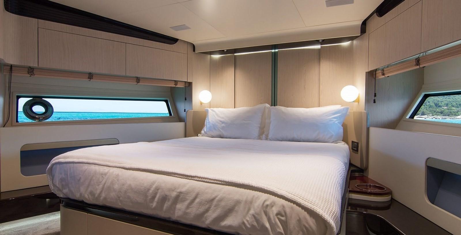 a bed with a white sheet aboard ALEX I Yacht for Sale