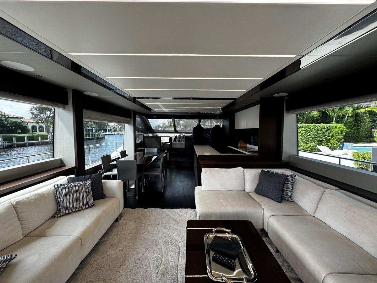 a living room with a large window aboard JOURNEY Yacht for Sale