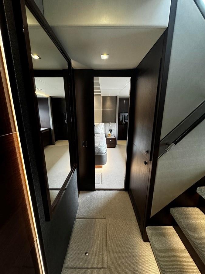 a hallway with glass doors aboard JOURNEY Yacht for Sale
