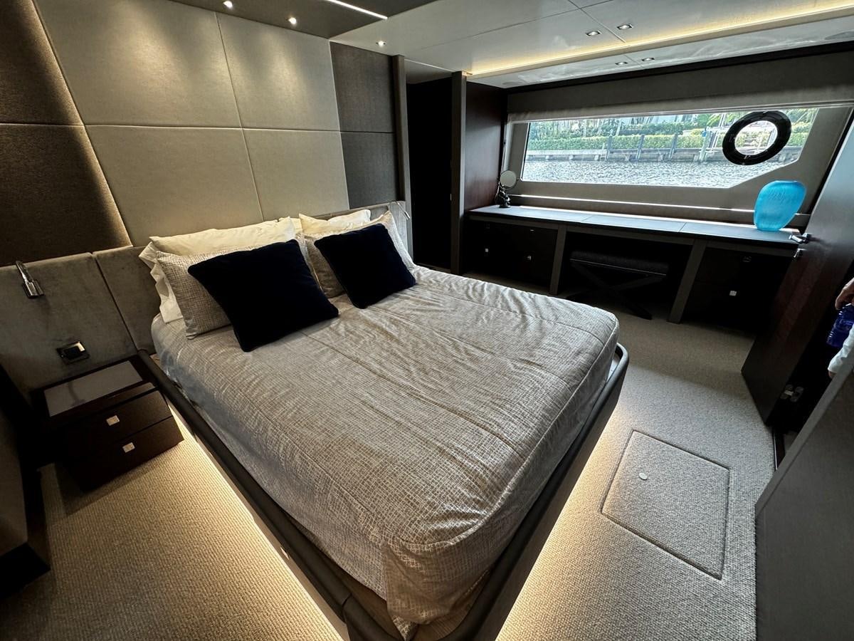 a room with a bed and a tv aboard JOURNEY Yacht for Sale