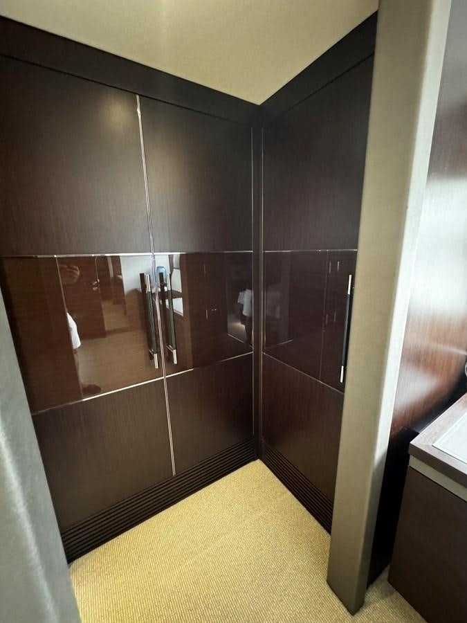a bathroom with a glass shower aboard JOURNEY Yacht for Sale