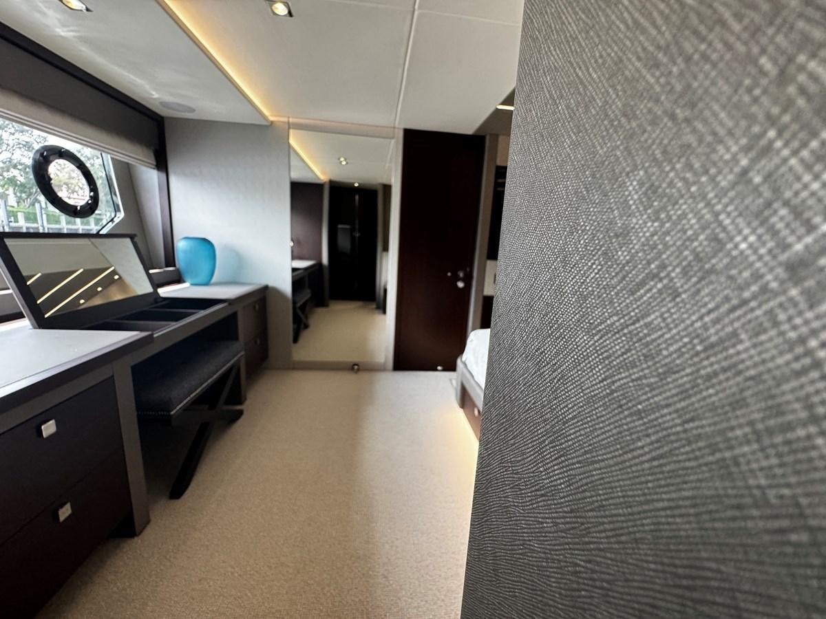 a room with a desk and a window aboard JOURNEY Yacht for Sale