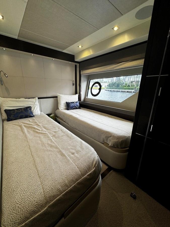 a room with two beds aboard JOURNEY Yacht for Sale