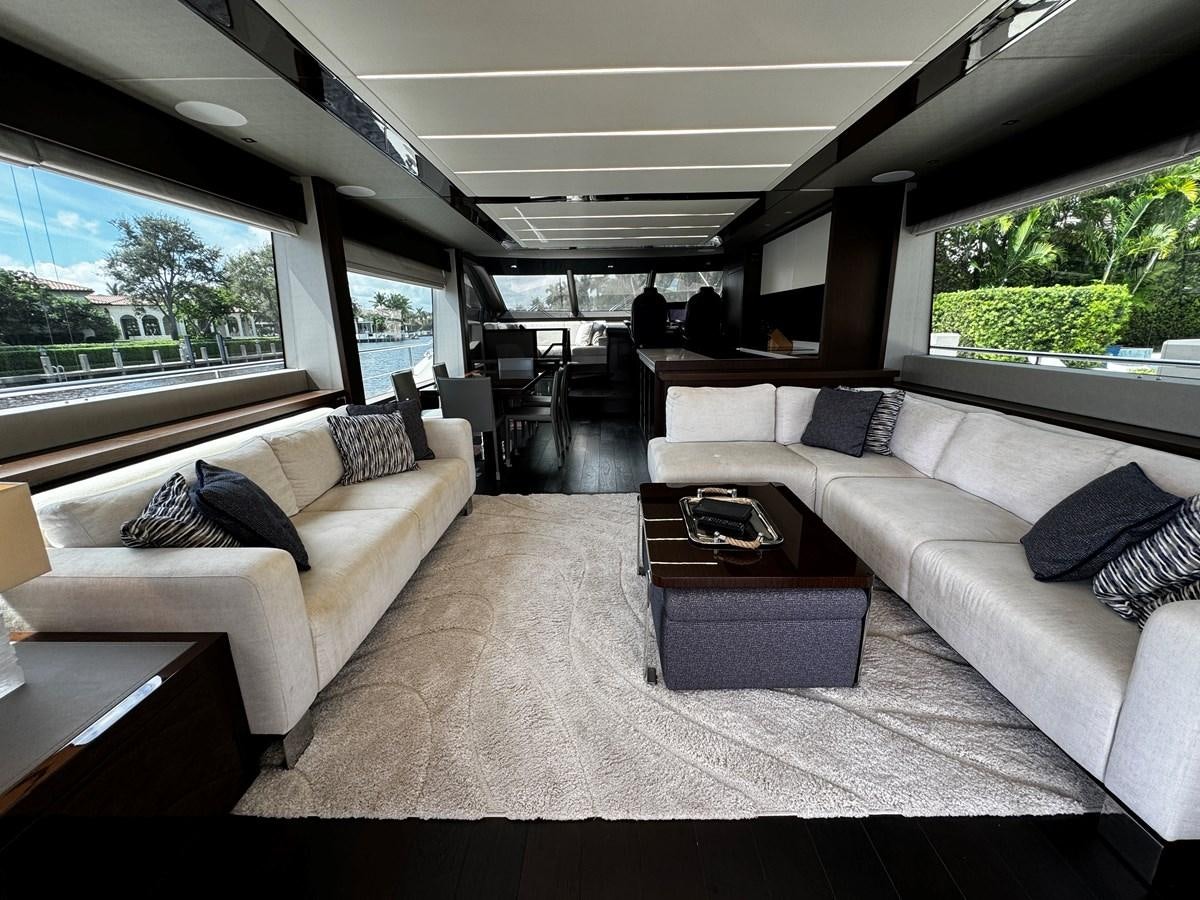a living room with a large window aboard JOURNEY Yacht for Sale
