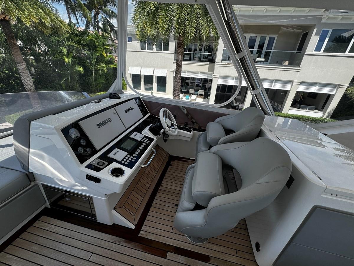 a white car with a seat belt aboard JOURNEY Yacht for Sale