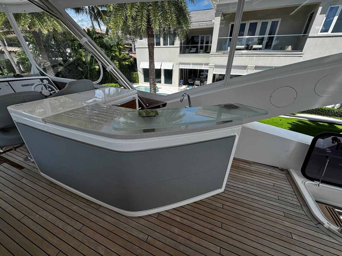 a white boat on a deck aboard JOURNEY Yacht for Sale