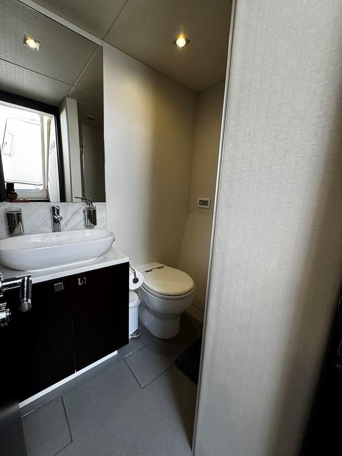 a bathroom with a sink and a toilet aboard JOURNEY Yacht for Sale