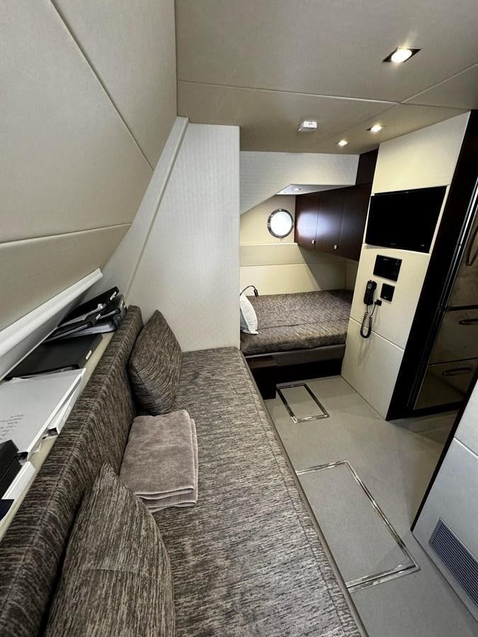 a living room with a couch aboard JOURNEY Yacht for Sale
