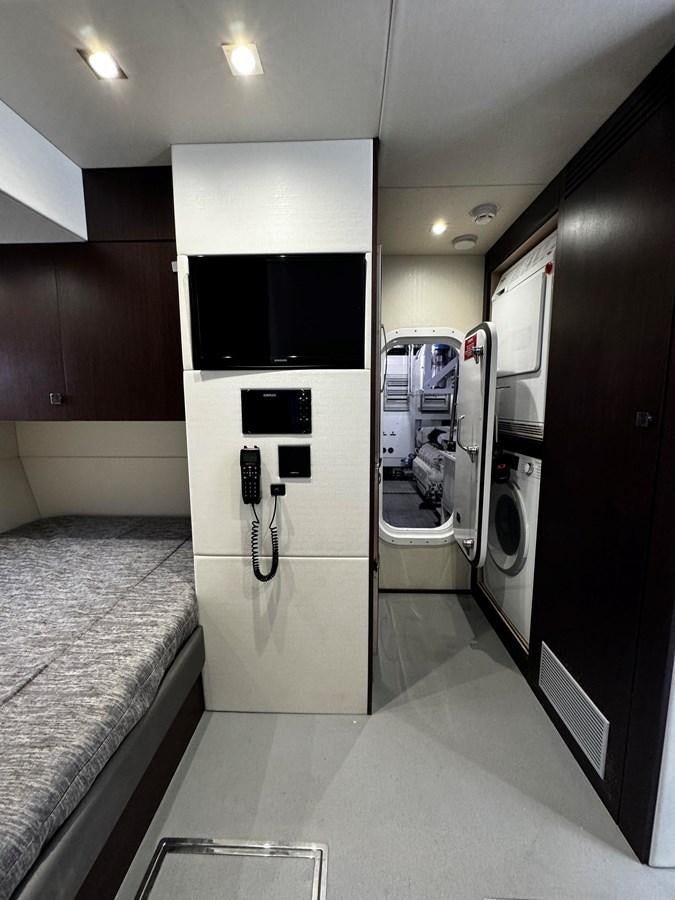 a bathroom with a large washer and dryer aboard JOURNEY Yacht for Sale