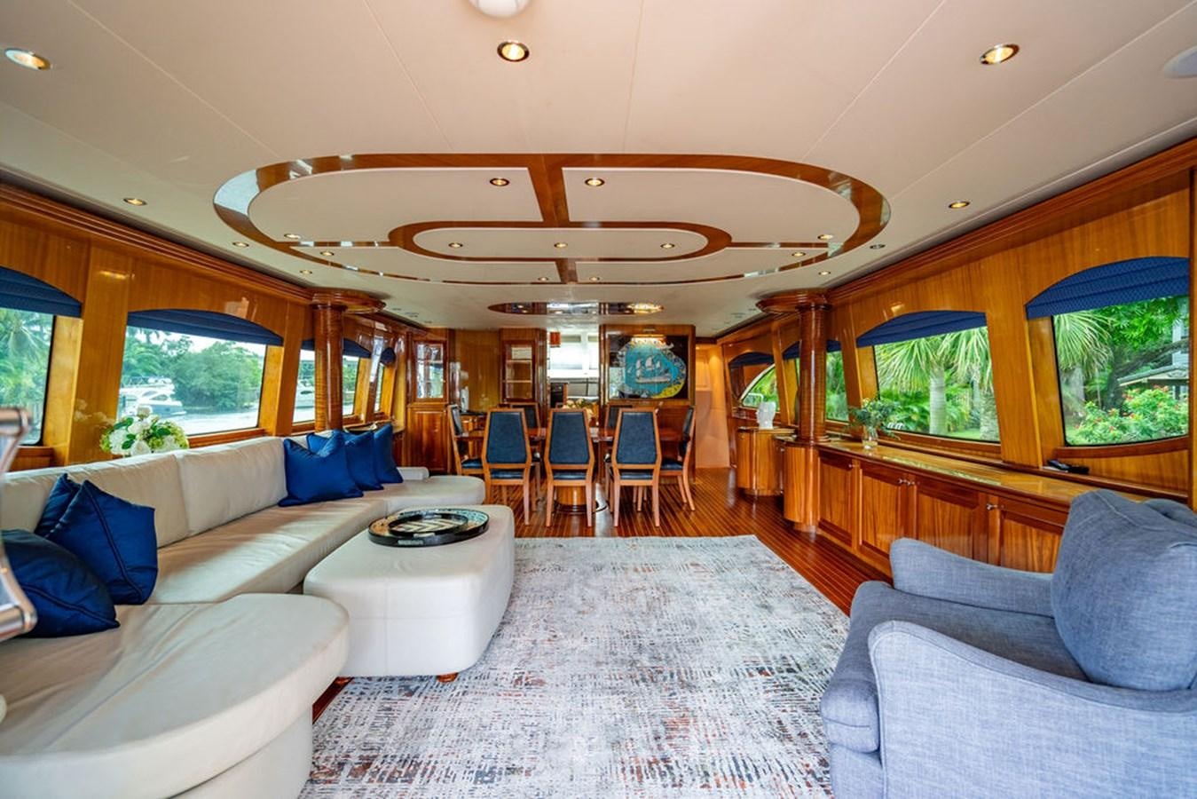 a large living room with a large open window aboard TOP SHELF Yacht for Sale