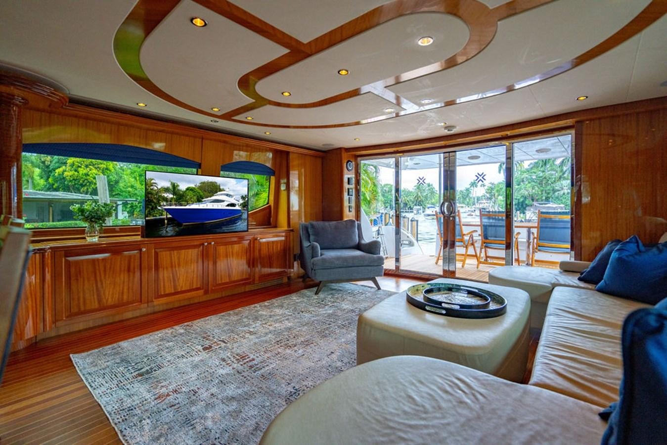 a living room with a large glass window aboard TOP SHELF Yacht for Sale
