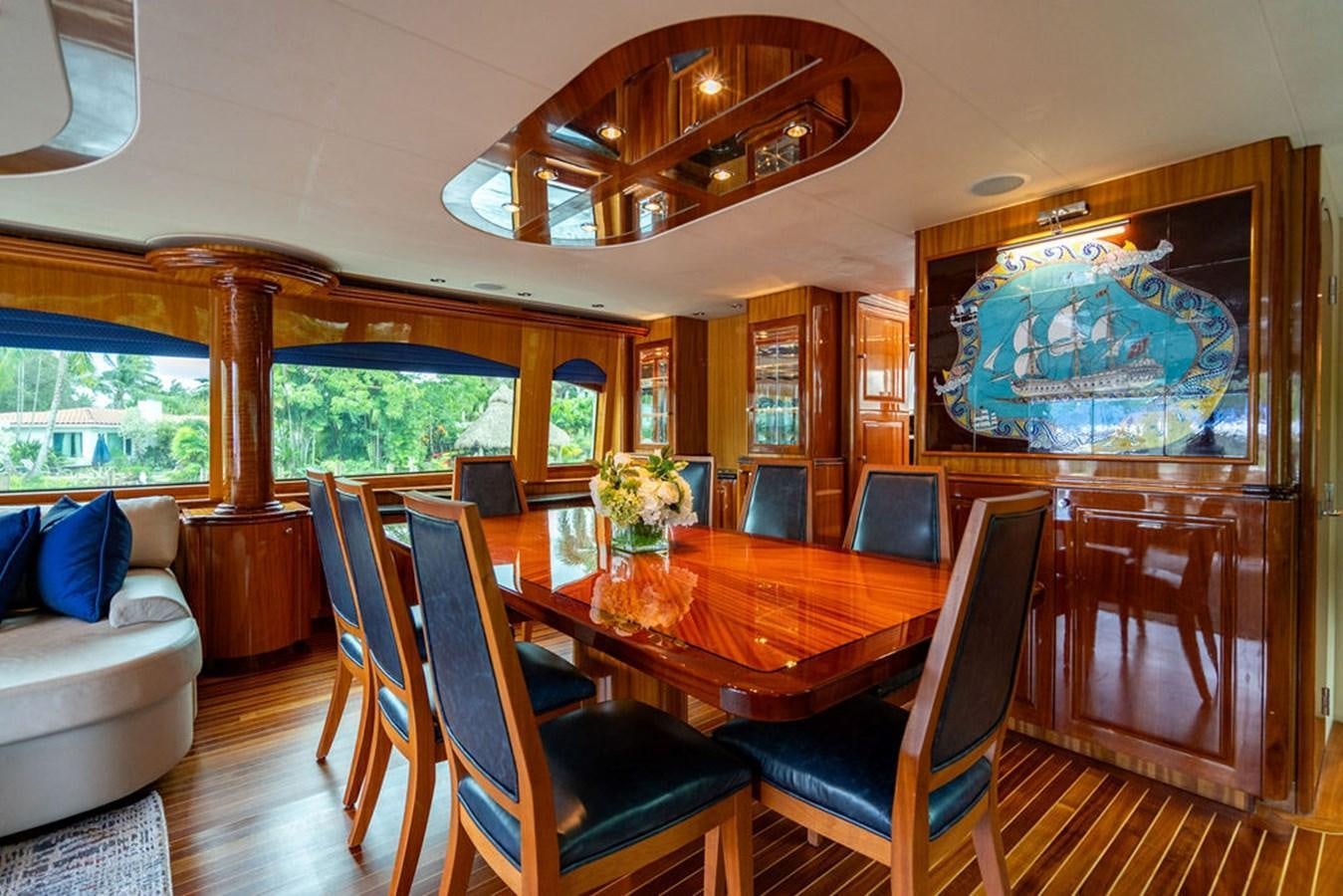 a dining room with a large table aboard TOP SHELF Yacht for Sale