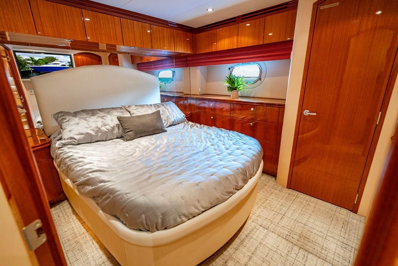 a bedroom with a bed aboard TOP SHELF Yacht for Sale