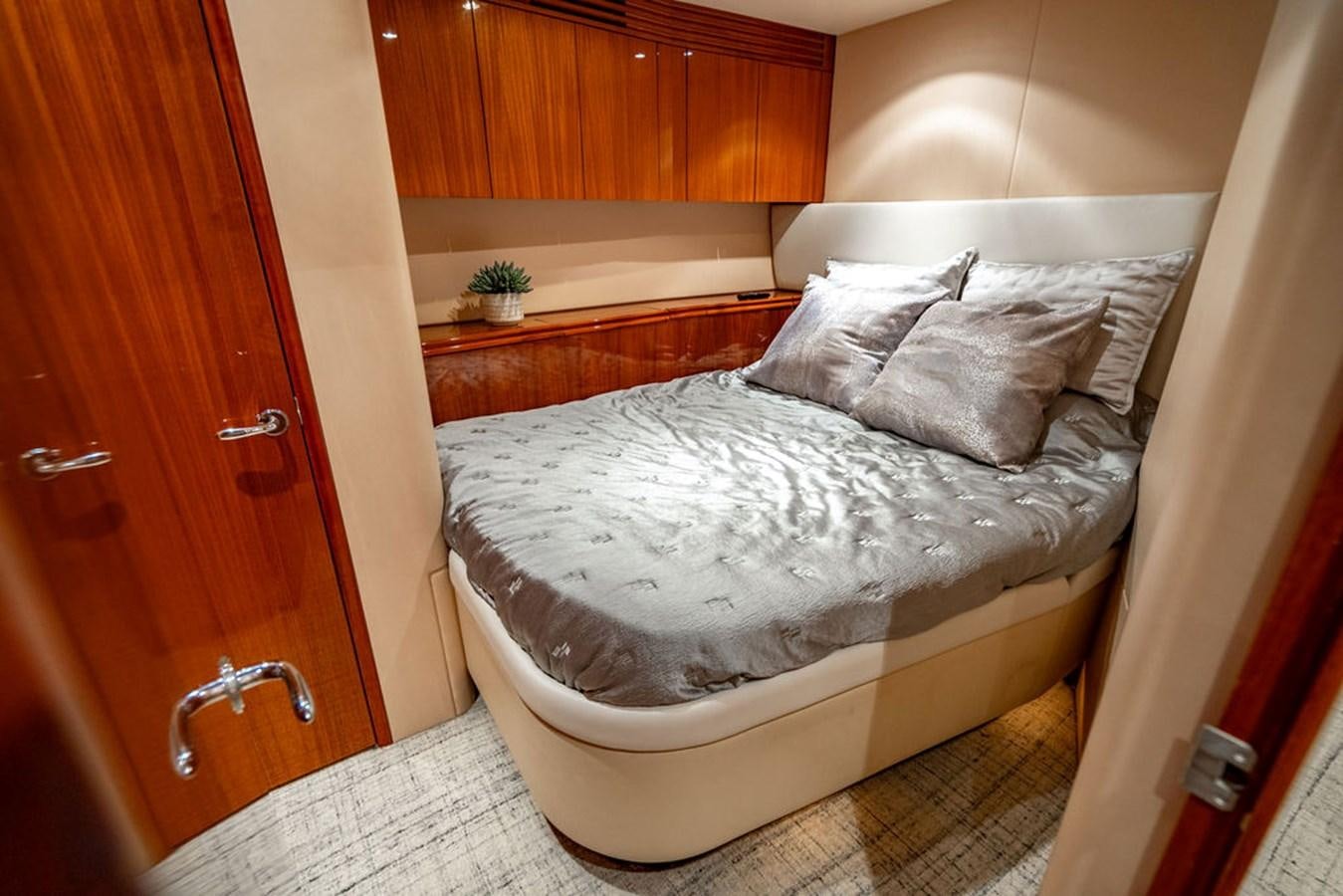 a bed in a room aboard TOP SHELF Yacht for Sale