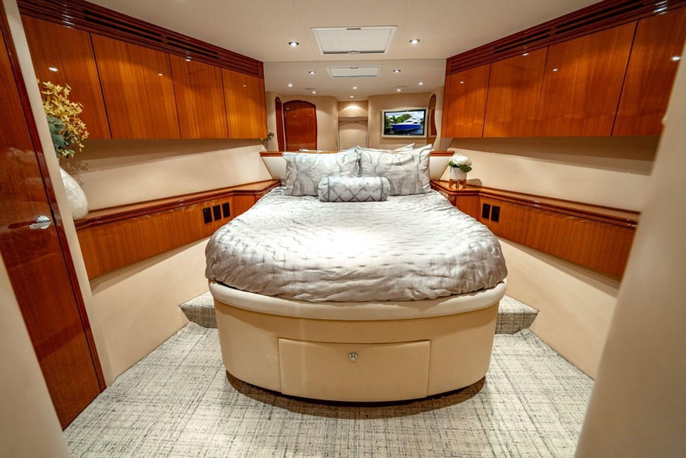 a large bedroom with a large bed aboard TOP SHELF Yacht for Sale