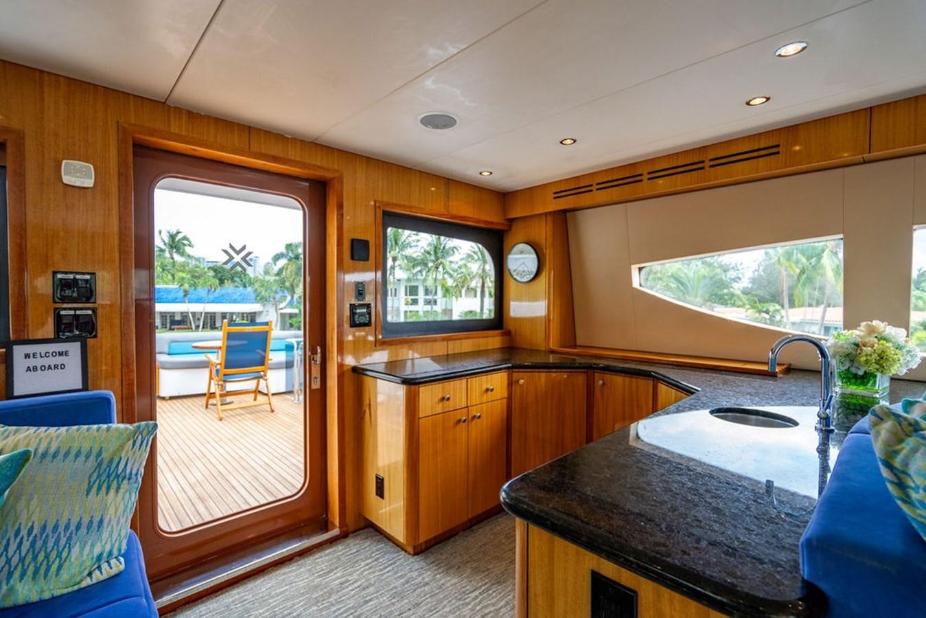 a kitchen with a large window aboard TOP SHELF Yacht for Sale