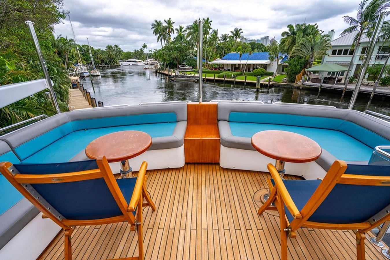 a deck with chairs and a pool aboard TOP SHELF Yacht for Sale