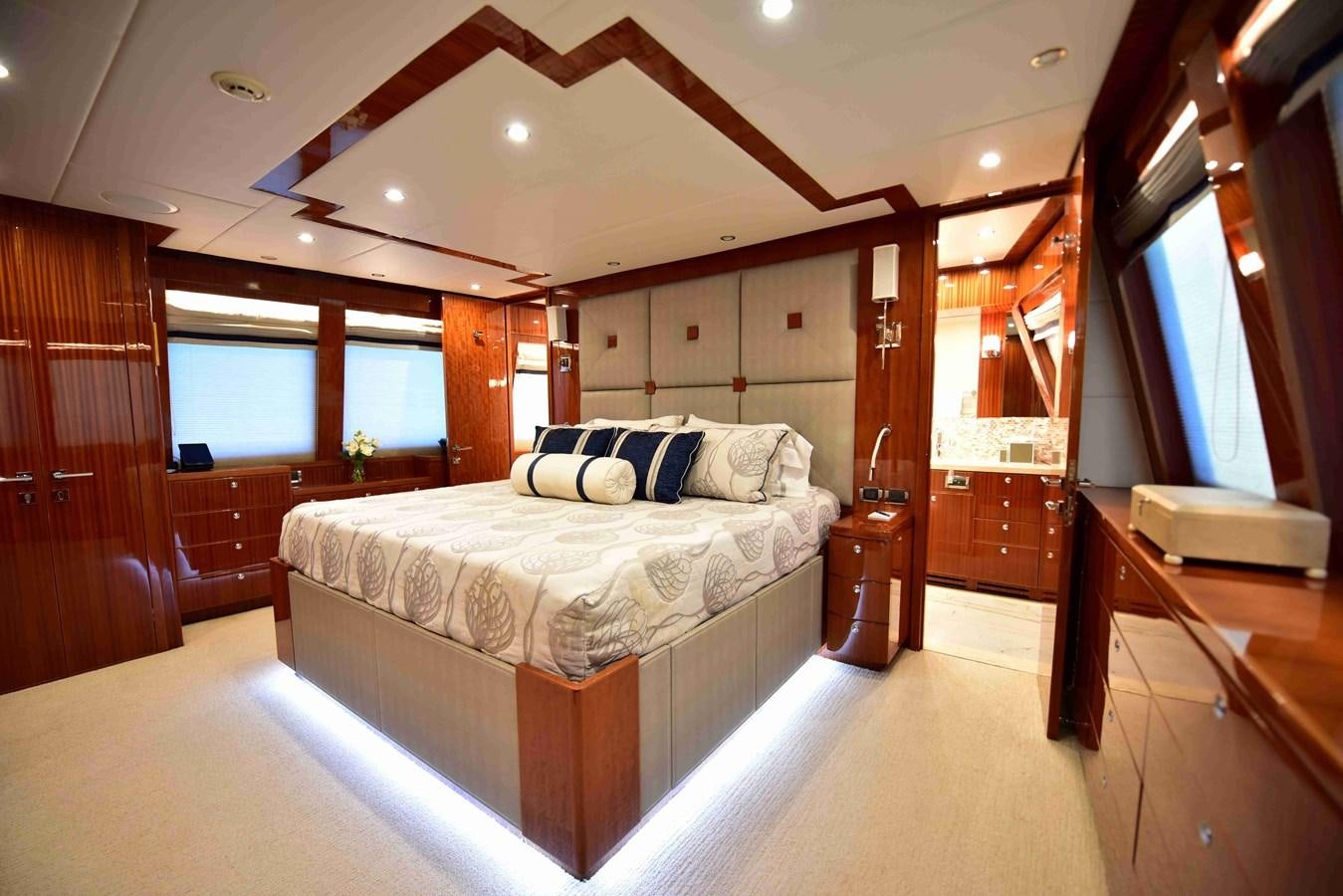 a bedroom with a bed and a desk aboard RENAISSANCE Yacht for Sale