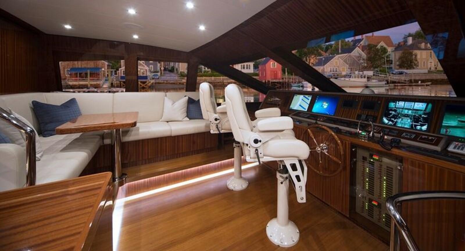 a white chair in a room aboard RENAISSANCE Yacht for Sale