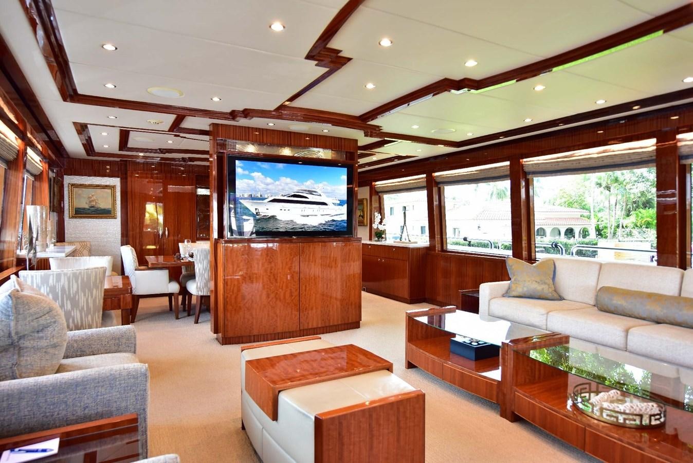 a living room with a large screen aboard RENAISSANCE Yacht for Sale