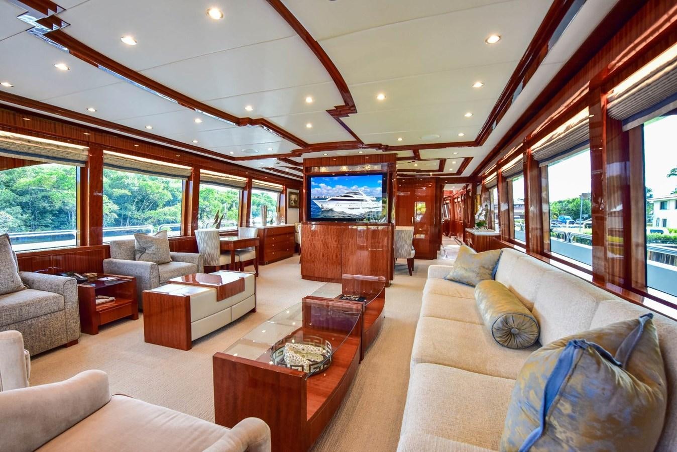 a living room with a large screen aboard RENAISSANCE Yacht for Sale
