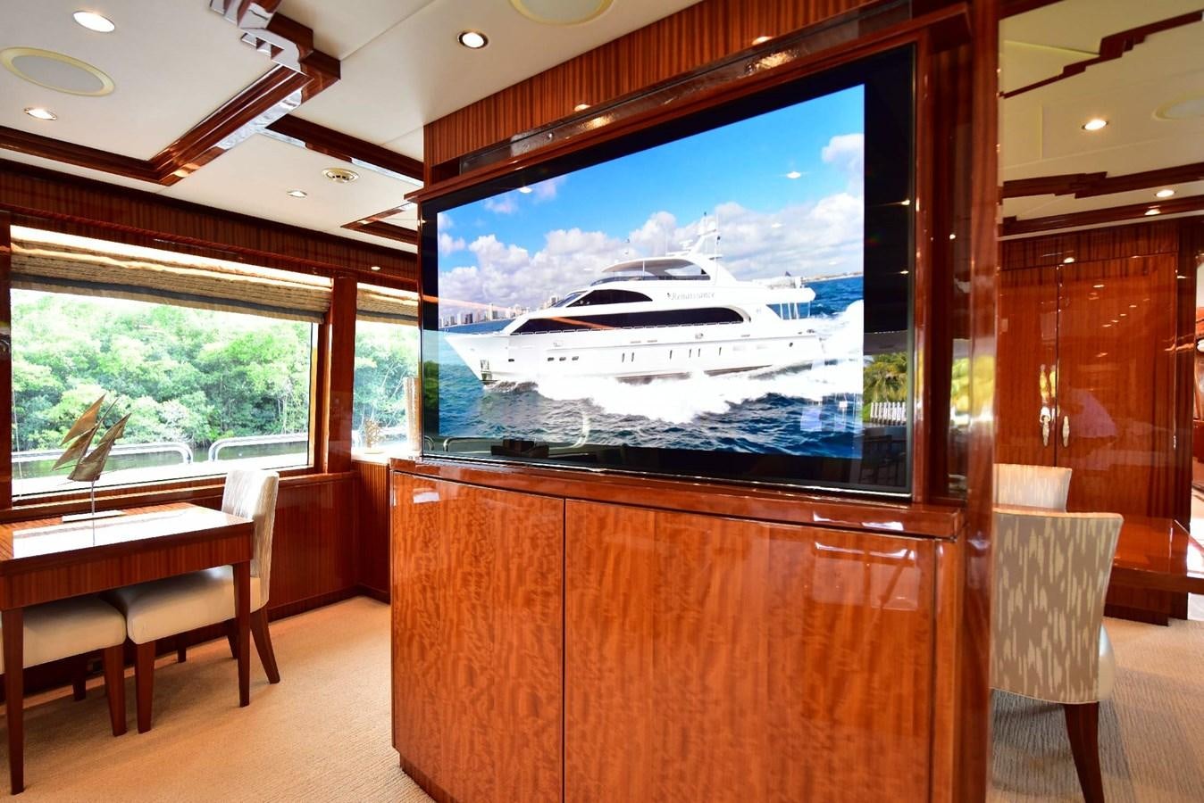 a room with a large window and a large painting on the wall aboard RENAISSANCE Yacht for Sale