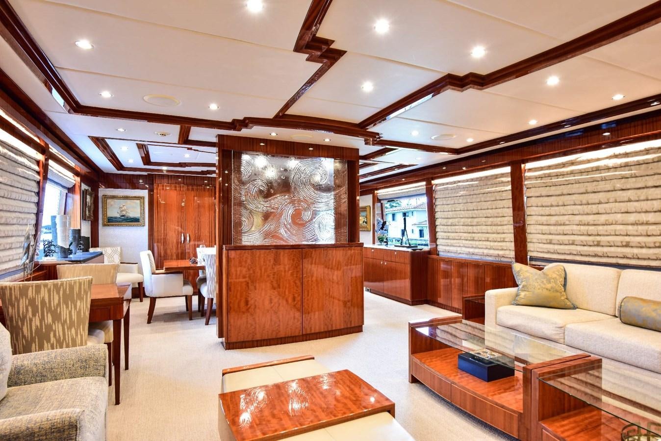 a living room with a large screen aboard RENAISSANCE Yacht for Sale