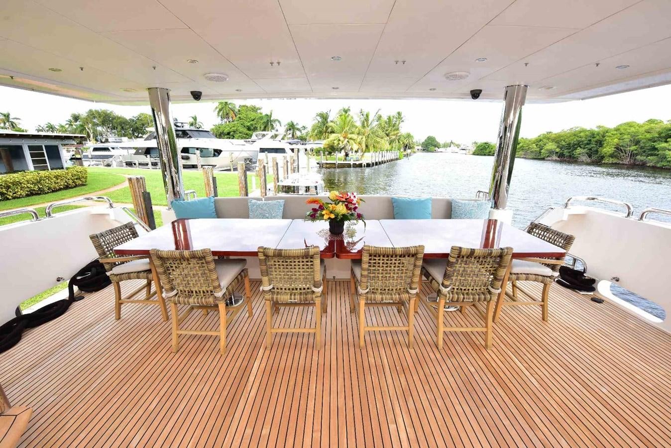 a table and chairs on a deck aboard RENAISSANCE Yacht for Sale
