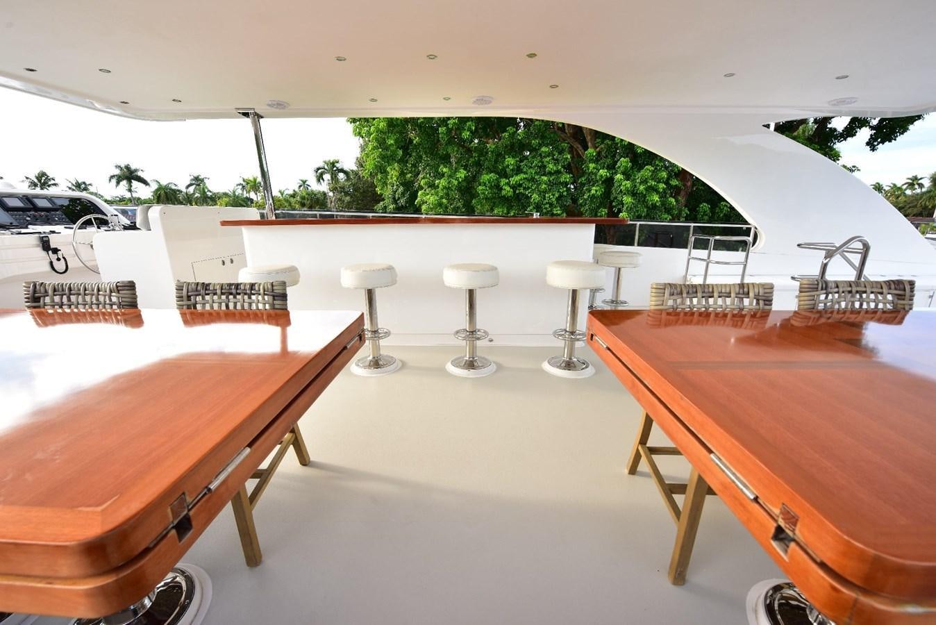 a table and chairs in a room aboard RENAISSANCE Yacht for Sale