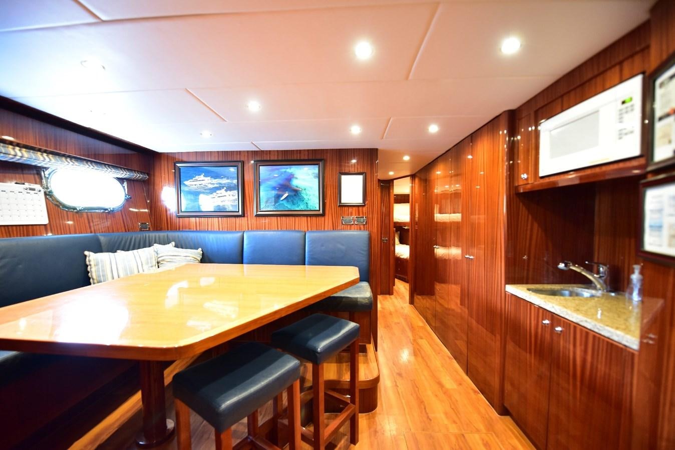 a room with a table and chairs aboard RENAISSANCE Yacht for Sale