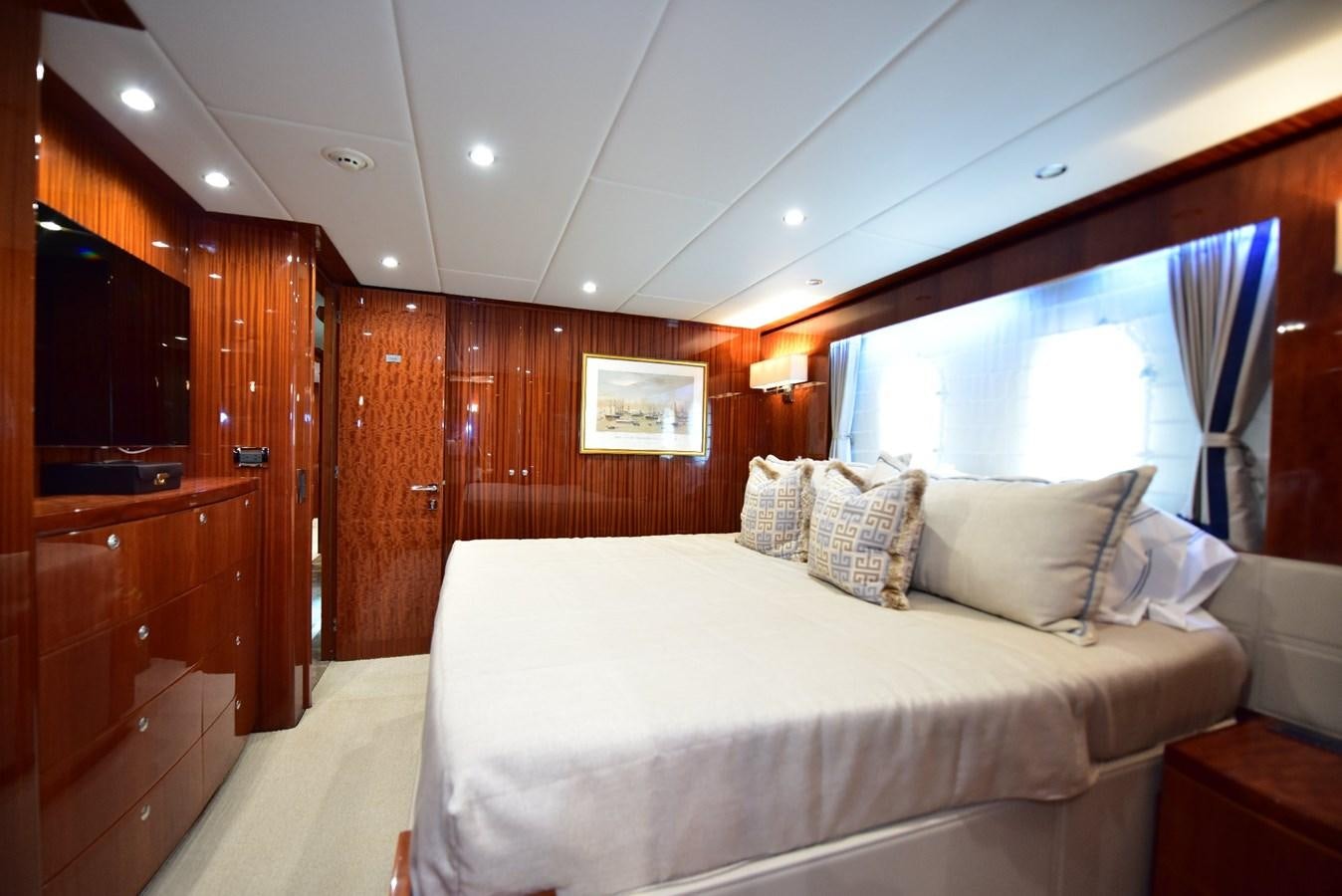a room with a bed and a wood wall aboard RENAISSANCE Yacht for Sale
