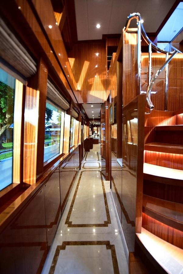 a wood staircase in a building aboard RENAISSANCE Yacht for Sale