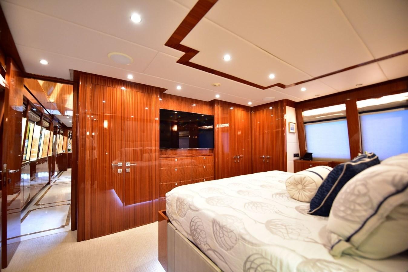 a bedroom with a glass door aboard RENAISSANCE Yacht for Sale