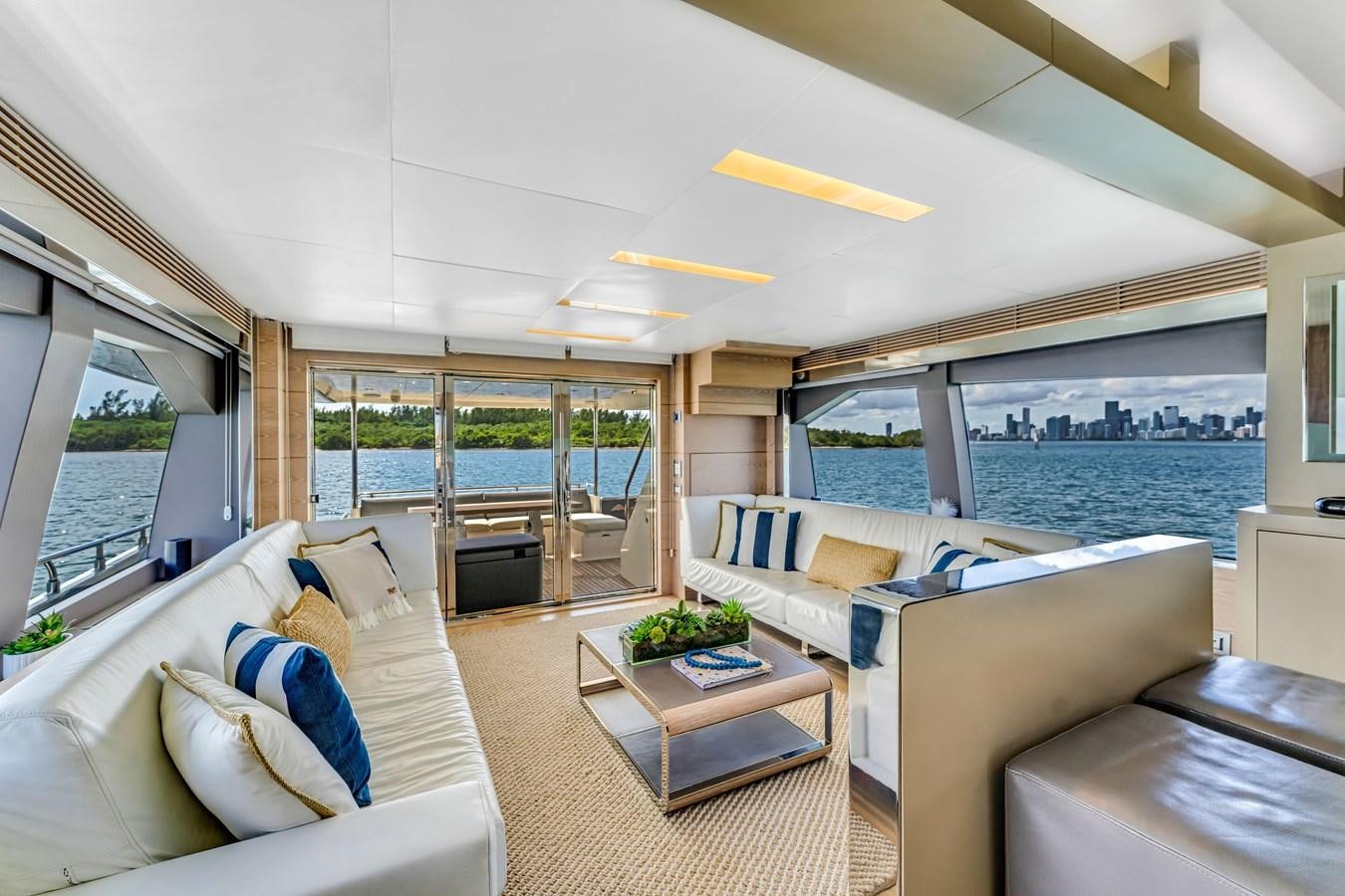 a living room with a large patio aboard SEADUCTION Yacht for Sale