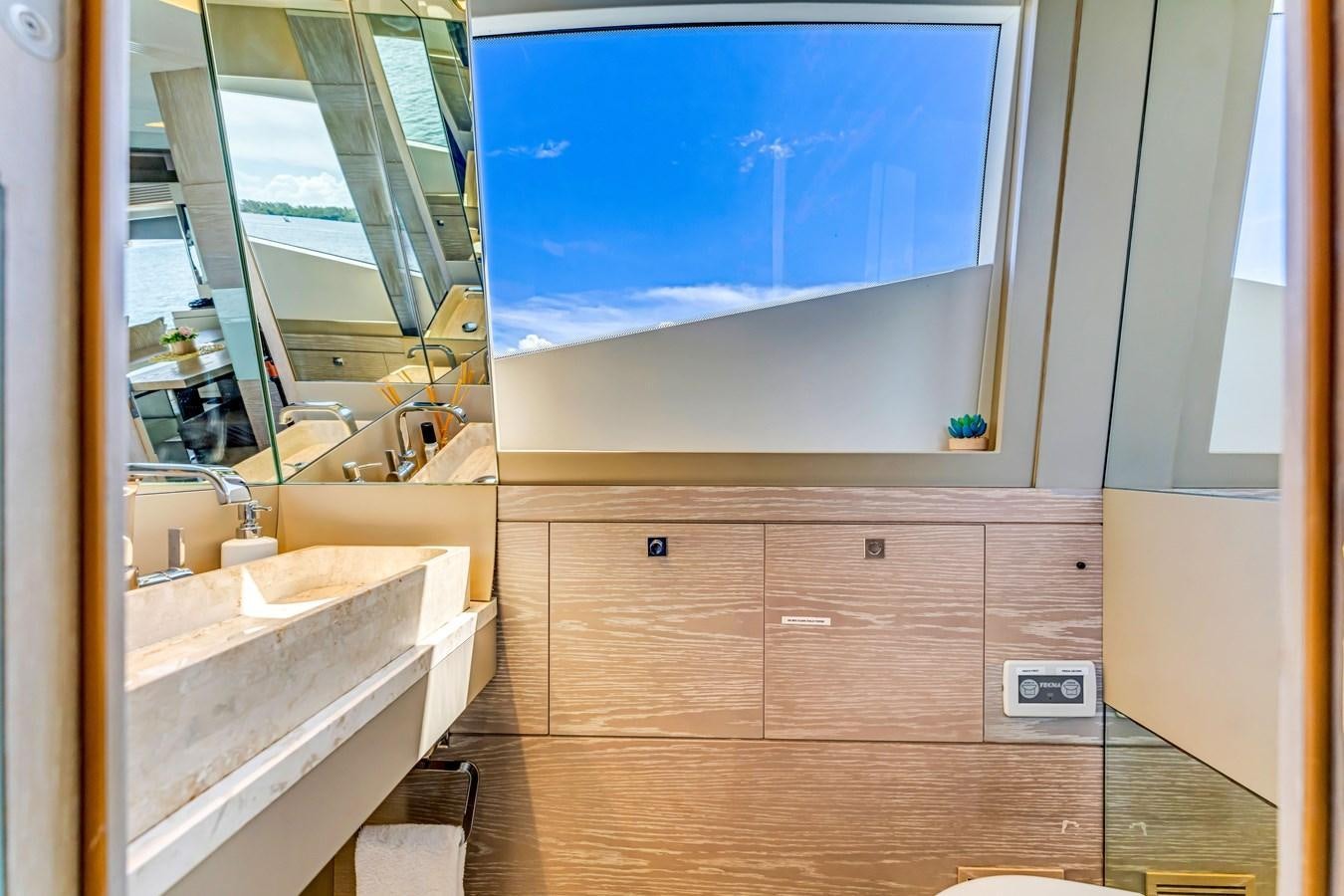 a bathroom with a large window aboard SEADUCTION Yacht for Sale
