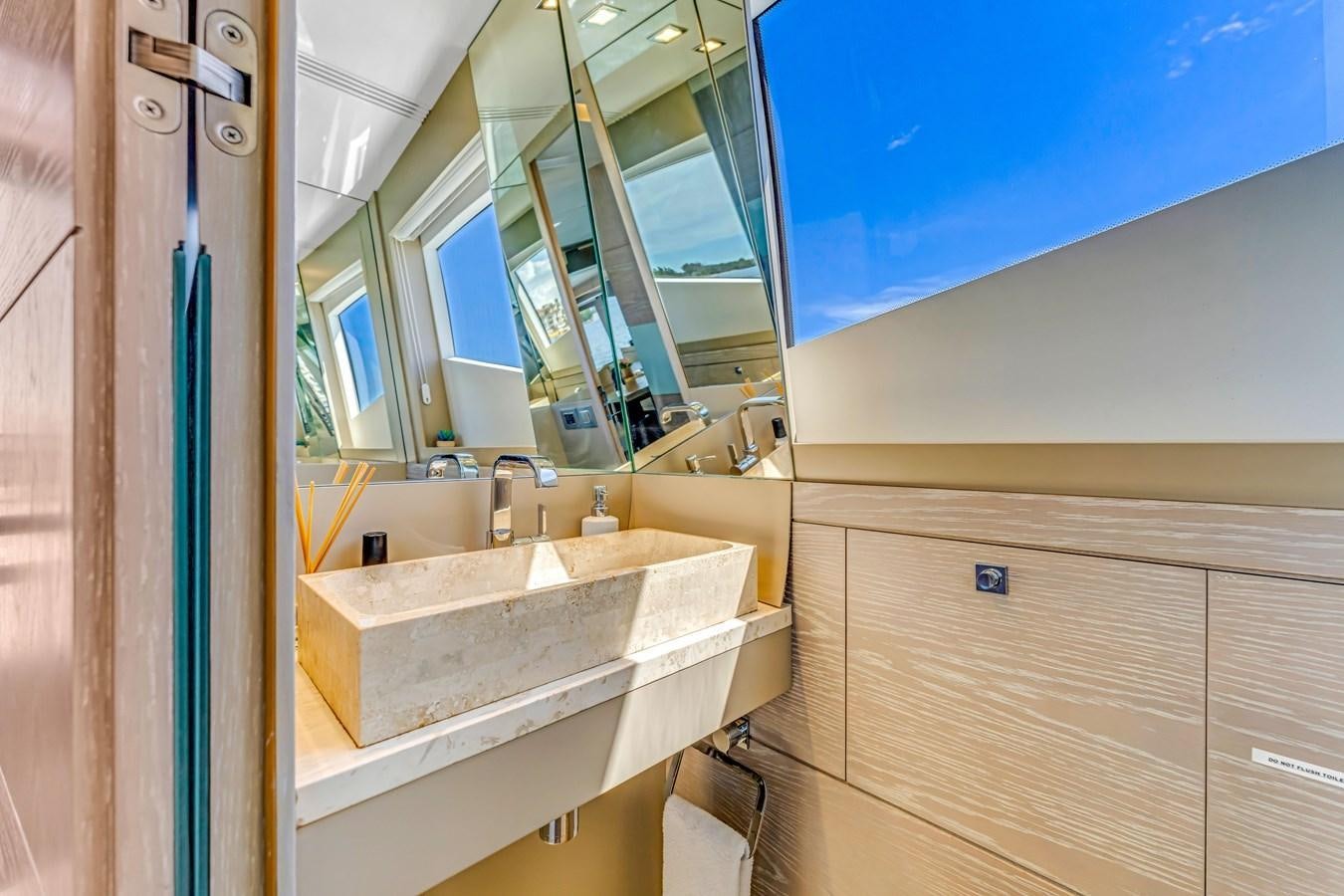 a bathroom with a sink and a mirror aboard SEADUCTION Yacht for Sale