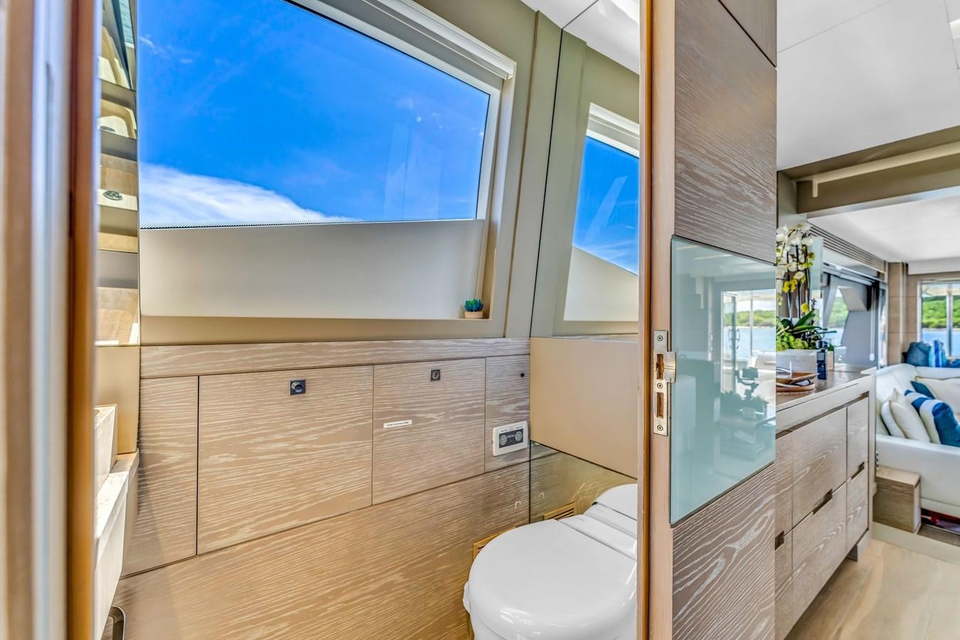 a bathroom with a large mirror aboard SEADUCTION Yacht for Sale