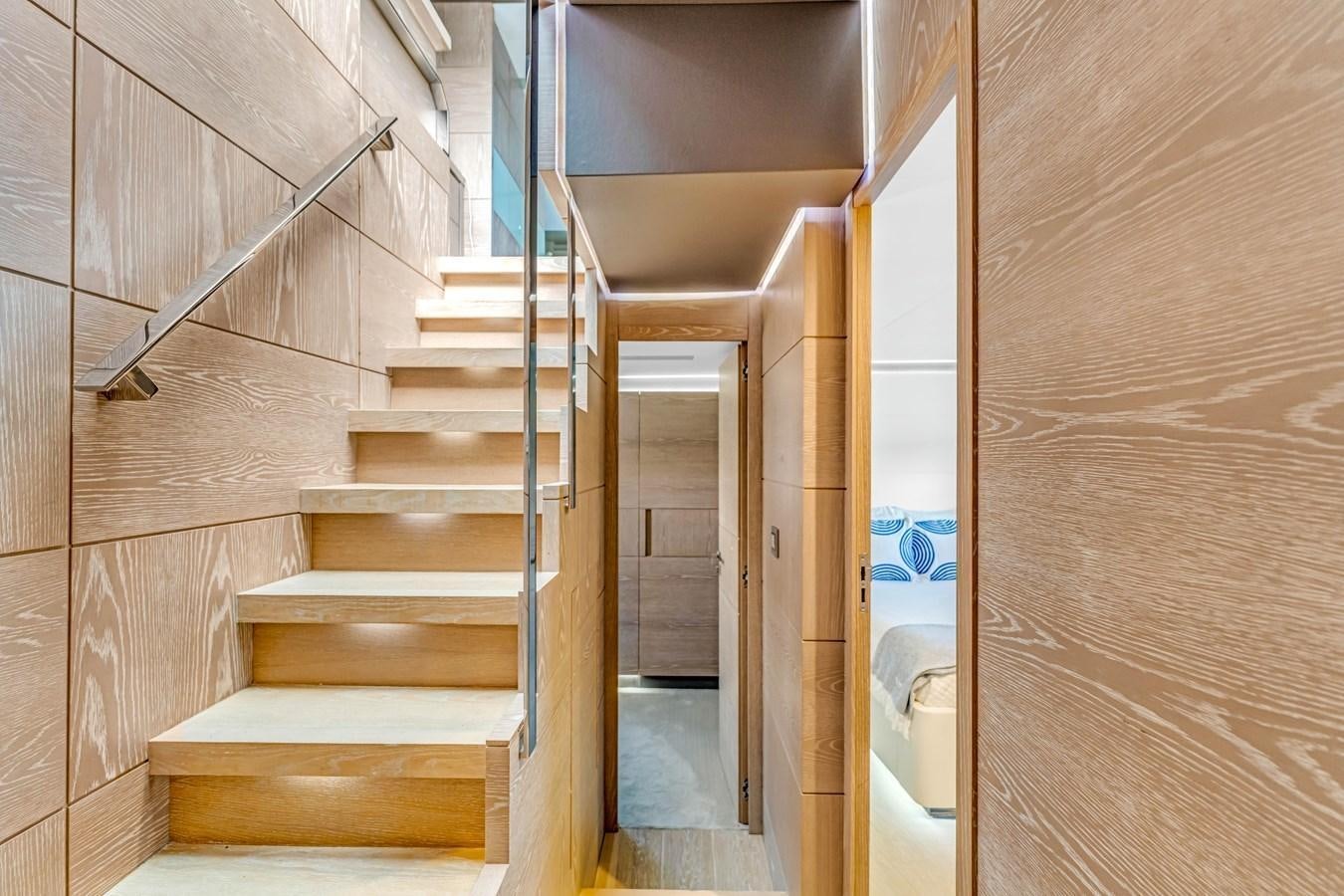 a wooden staircase in a room aboard SEADUCTION Yacht for Sale
