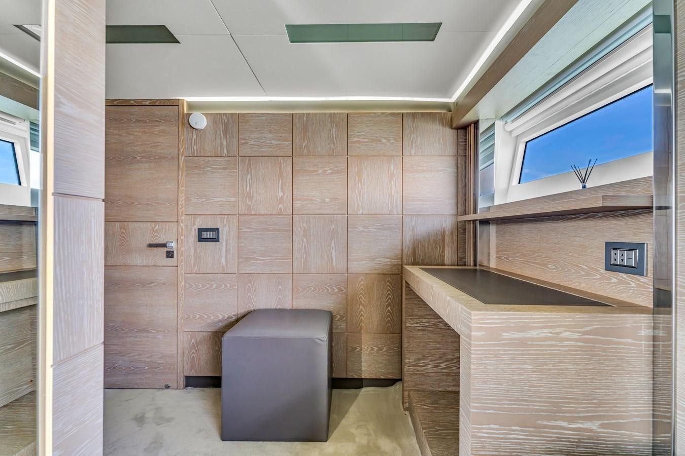 a room with wooden cabinets aboard SEADUCTION Yacht for Sale