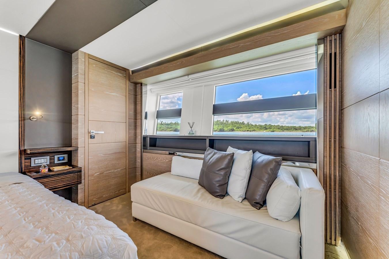 a room with a bed and a window aboard SEADUCTION Yacht for Sale