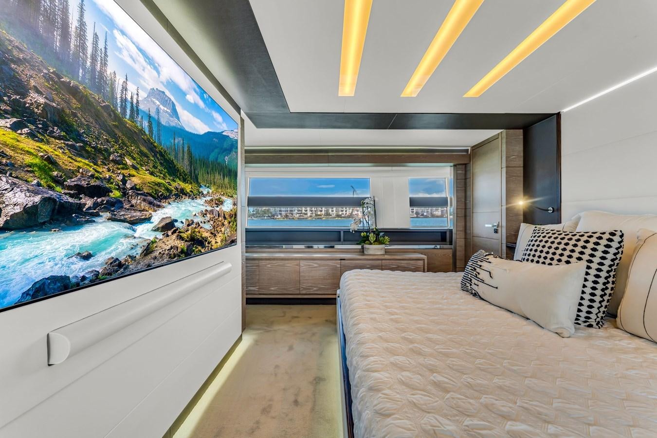 a room with a couch and a large fish tank aboard SEADUCTION Yacht for Sale