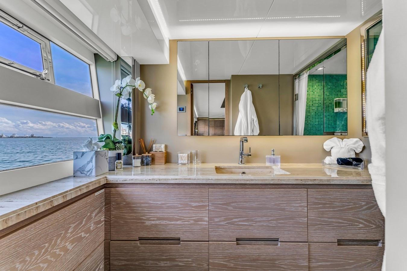 a bathroom with a large mirror aboard SEADUCTION Yacht for Sale