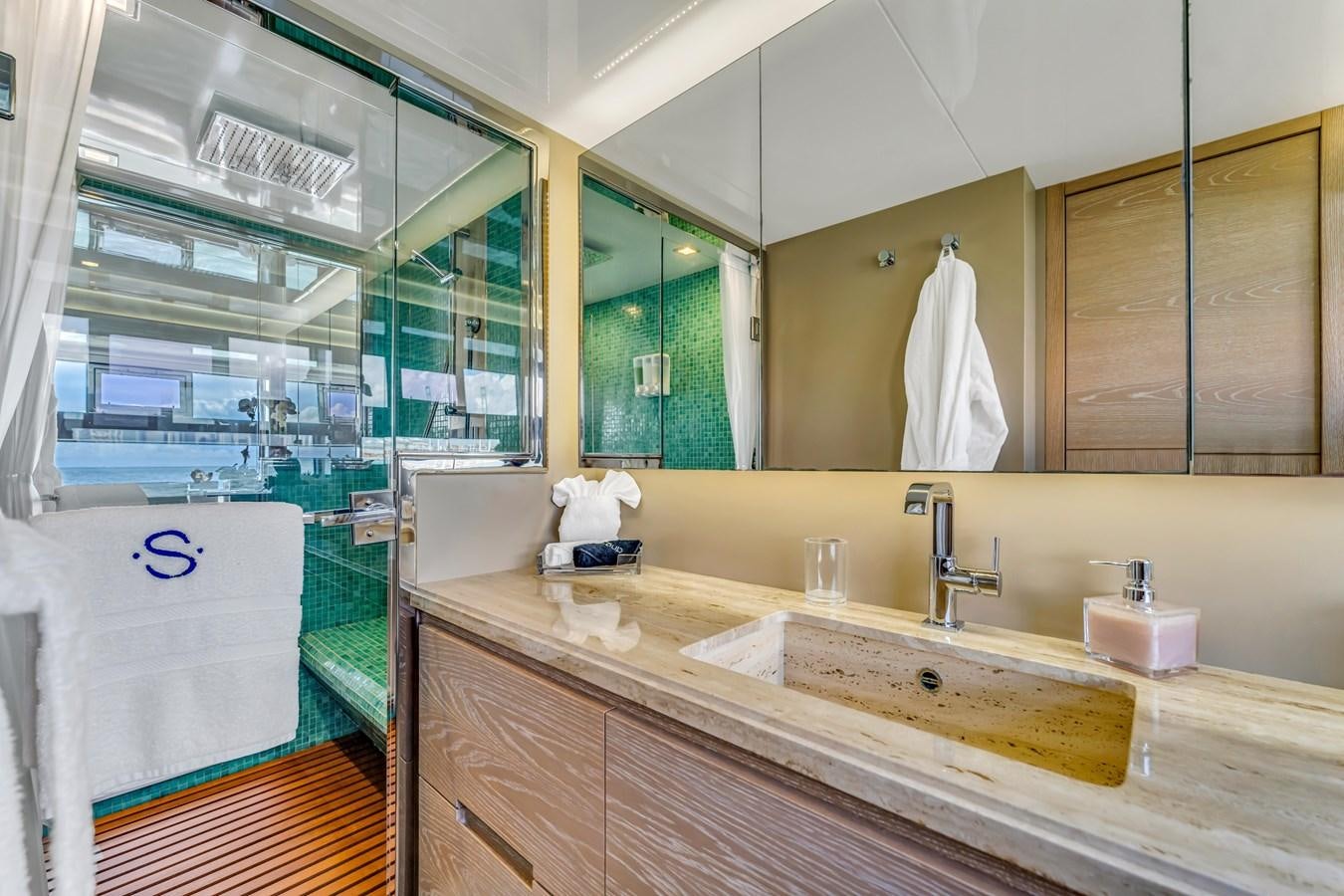 a bathroom with a large mirror aboard SEADUCTION Yacht for Sale