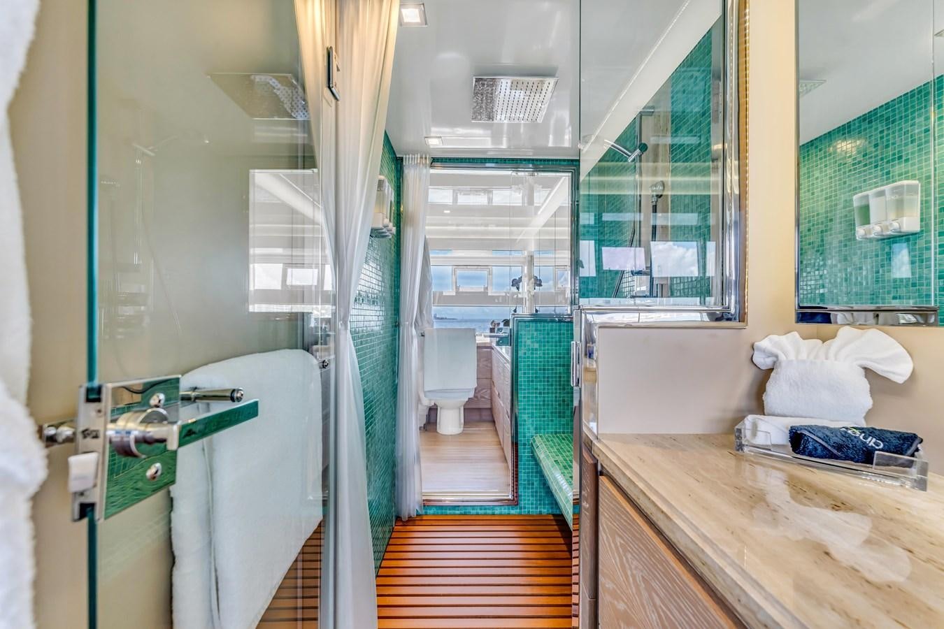 a bathroom with a shower and a sink aboard SEADUCTION Yacht for Sale